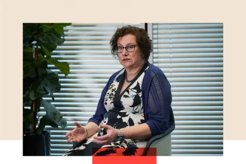 PA Dr Hilary Cass sitting on a chair, gesturing with her arms