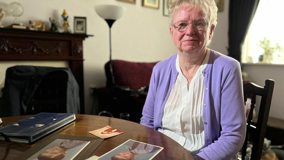 Linda sitting at a table