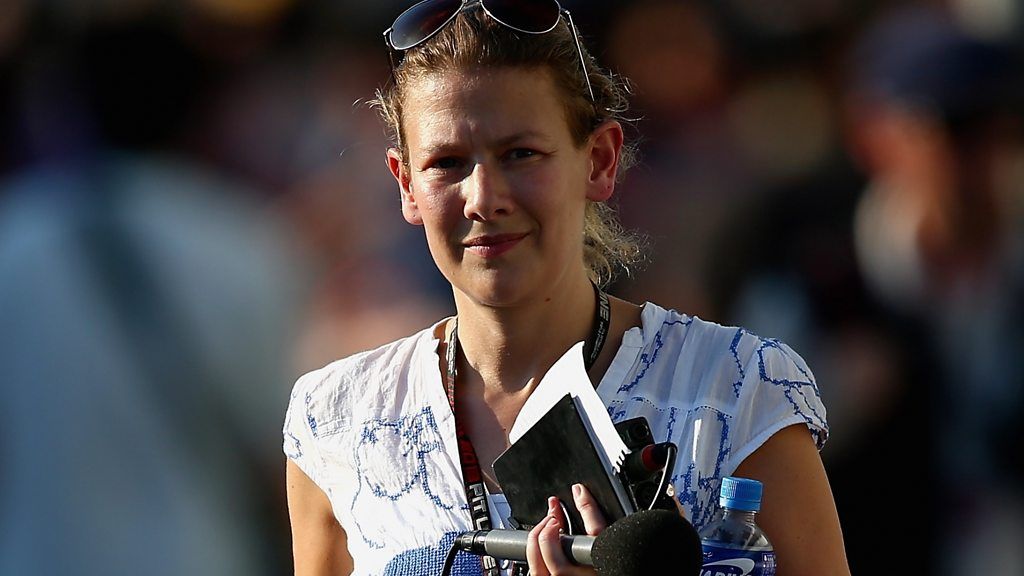 Jennie Gow with sunglasses and microphone