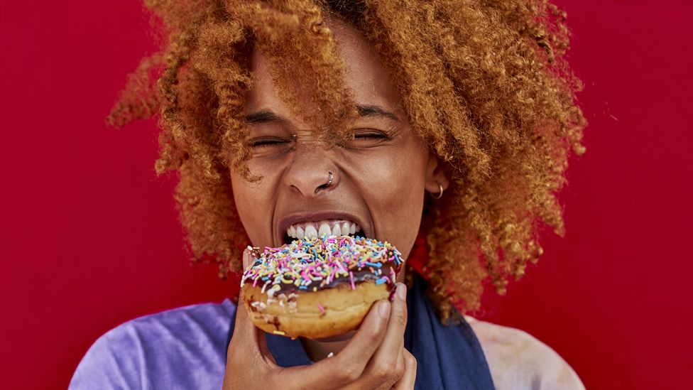 Woman eating a donut