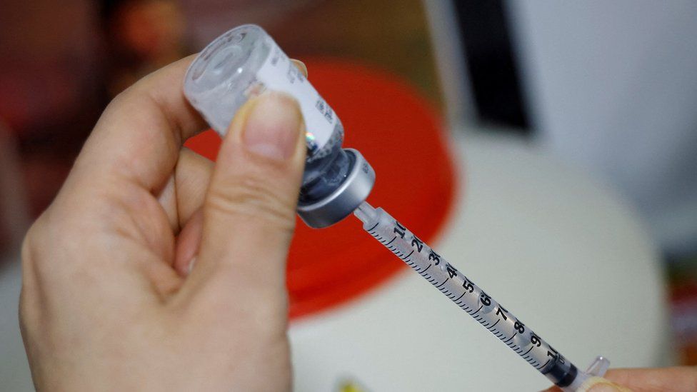 a healthcare worker prepares a Botox injection