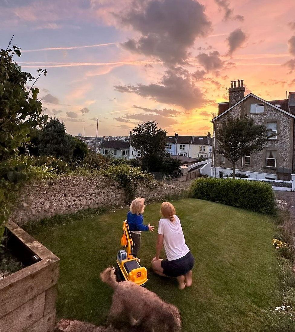 Lucy Rose plays with her son Otis in the garden