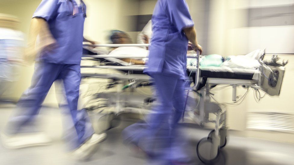 Nurses with patient in hospital (stock photo)