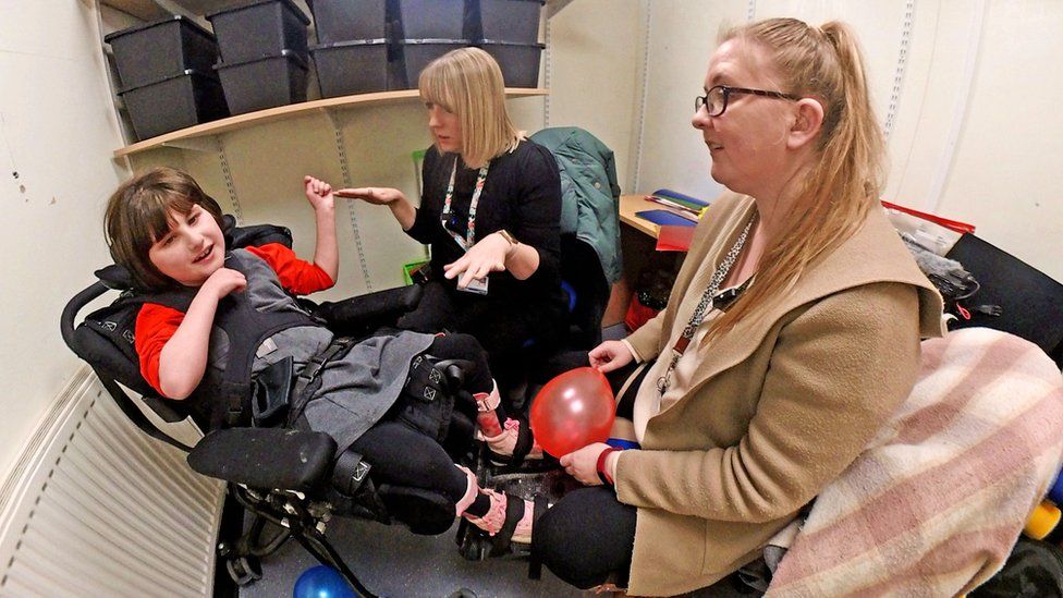 A visual-impairment session taking place in a former resource cupboard