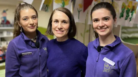 Topaz, Victoria and Sade Oram pictured arm in arm, smiling