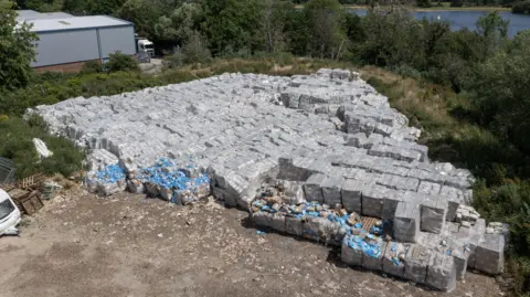 Getty Images Aerial view of large amount of PPE dumped on a farm 