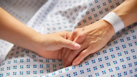 Getty Images Clasped hands (stock image)