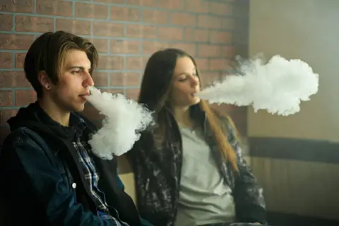 Getty Teenagers blowing smoke