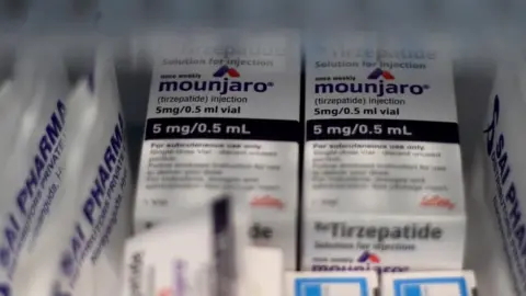 Reuters An image of white medical boxes branded as Mounjaro.
