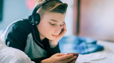 Getty Images Boy with headphones on