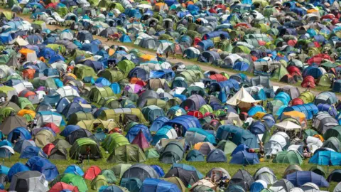 Getty Images A shot of a crowded campsite at Glastonbury Festival