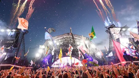 Getty Images The pyramid stage at Glastonbury lit up by fireworks as a headline act performs