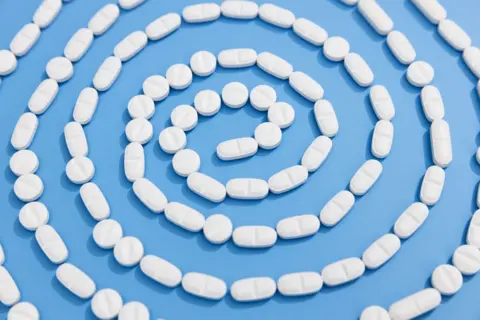 Getty Images Medication on a blue background