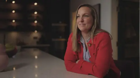 Charlotte Stirling-Reed, sitting at a kitchen worktop