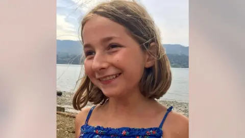 Mills/Laity family photograph/PA Wire A family photo of Martha Mills, smiling and wearing a blue, flowery top with the sea in view behind her