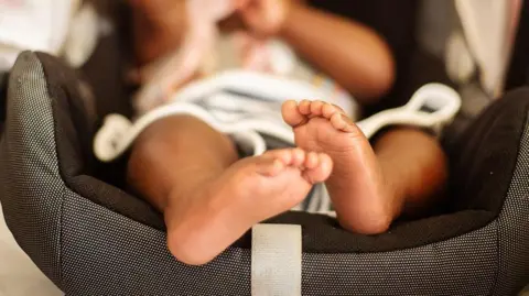 Getty Images Newborn baby in travel seat