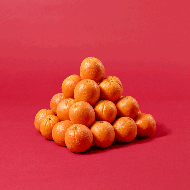Animation of oranges being stacked into a 4 by 4 by 4 pyramid, on a red background.