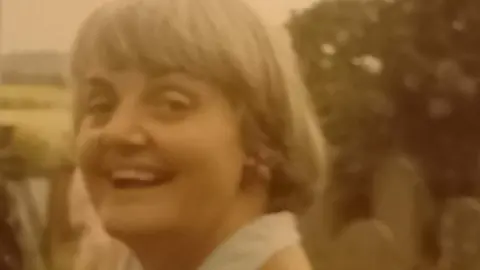 Nias family handout An old sepia-tinged image of Jennifer Nias as a young woman laughing at the camera, her hair in a short blond bob with fringe.