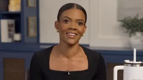 Candace Owens Right-wing US influencer Candace Owens, a black woman wearing earrings and looking at the camera