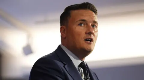 PA Media Wes Streeting giving a speech