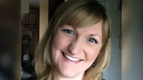 LinkedIn A photo of Karen Booth, smiling broadly with her head tilted. She has blonde hair with a sweeping fringe and the image is closely cropped showing her face and neck.  