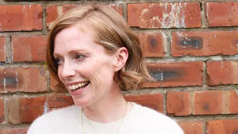 Helen Ledwick Woman with short hair smiling