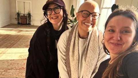 @Charlotteamyphotography Three young woman smiling to camera in a room 