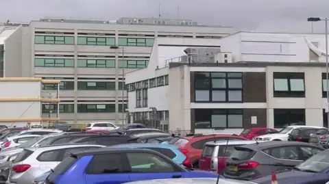 A carpark outside a hospital.